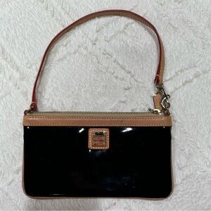 Dooney & Bourke clutch. Used condition. Black and brown.